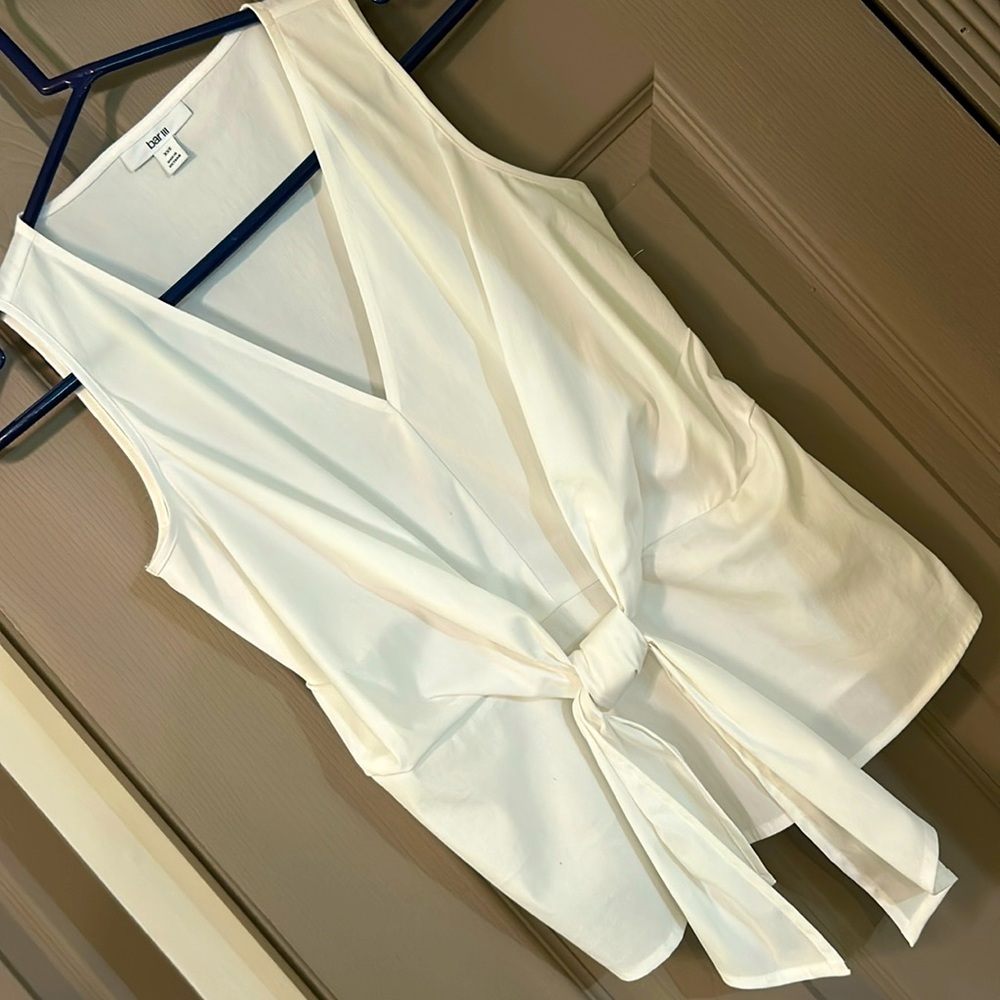 White blouse with front tie and cute peplum design. Size X small